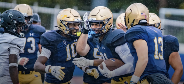 JCU football team on field photo